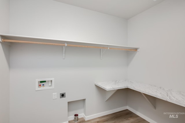 laundry room featuring hookup for a washing machine, electric dryer hookup, and hardwood / wood-style floors