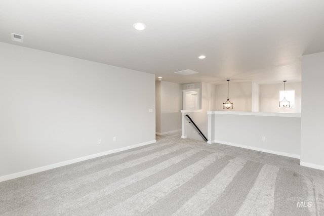 empty room with light colored carpet