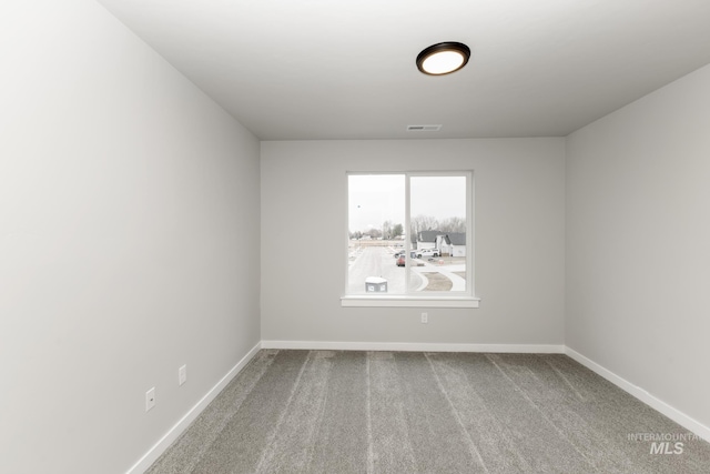 empty room featuring carpet flooring