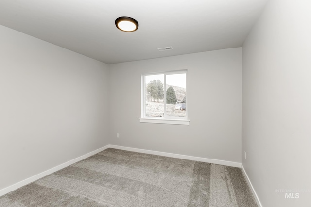 unfurnished room featuring carpet floors