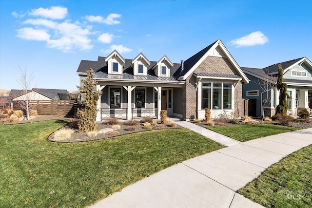 view of front of house featuring a front yard and a porch