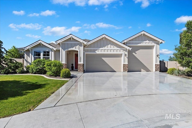 2033 E Whitetail St, Kuna, ID 83634 - craftsman inspired home with an attached garage, board and batten siding, stone siding, and driveway