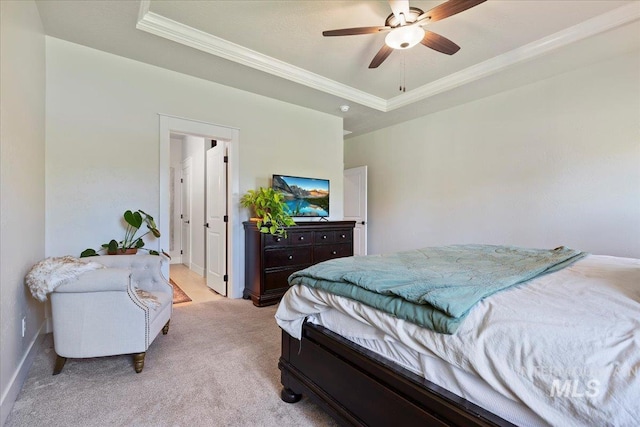 2033 E Whitetail St, Kuna, ID 83634 - bedroom with a tray ceiling, crown molding, light carpet, baseboards, and a ceiling fan