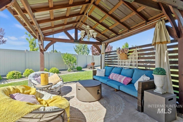 2033 E Whitetail St, Kuna, ID 83634 - fenced backyard featuring an outdoor hangout area, a gazebo, a patio, and ceiling fan