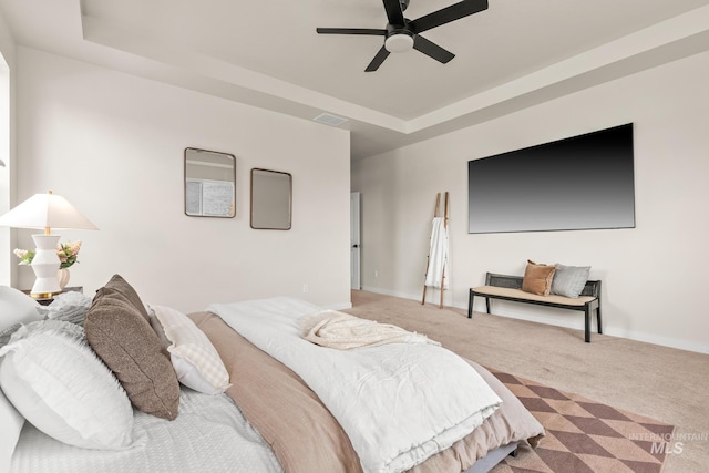 18293 N Begonia Way, Nampa, ID 83687 - carpeted bedroom with a raised ceiling, a ceiling fan, and baseboards