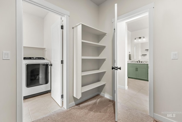 18293 N Begonia Way, Nampa, ID 83687 - corridor with washer / dryer, light tile patterned flooring, and baseboards