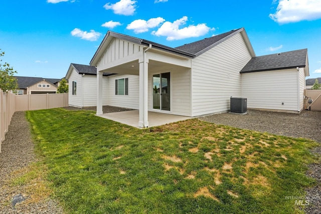18293 N Begonia Way, Nampa, ID 83687 - rear view of house featuring board and batten siding, a patio area, central air condition unit, and a shingled roof