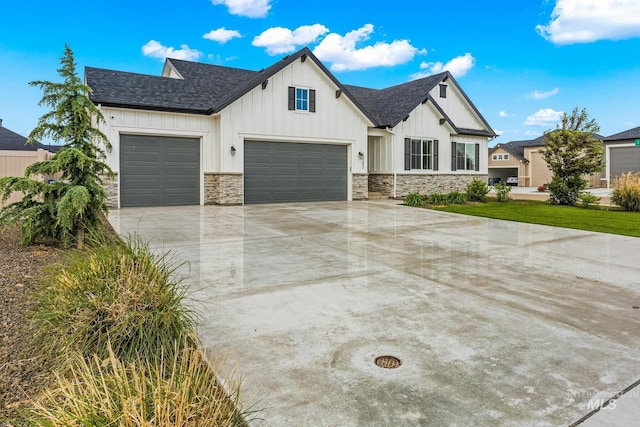 18293 N Begonia Way, Nampa, ID 83687 - modern inspired farmhouse featuring board and batten siding, a garage, concrete driveway, stone siding, and a shingled roof