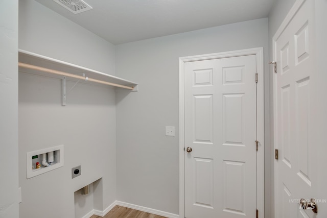 washroom featuring laundry area, baseboards, visible vents, hookup for a washing machine, and electric dryer hookup