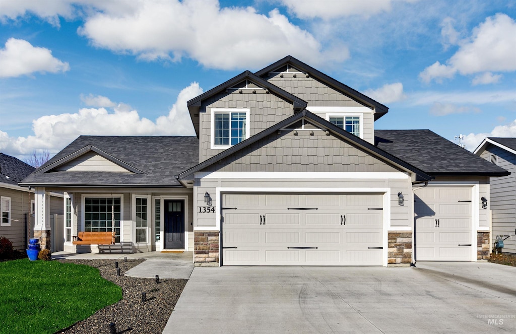 craftsman-style house with a porch and a garage