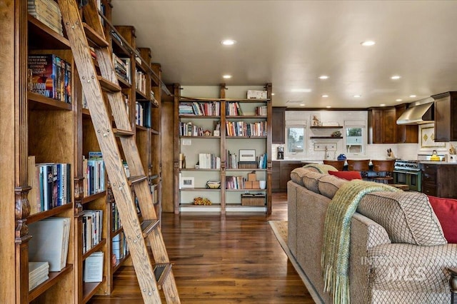 living room featuring recessed lighting and dark wood-style floors