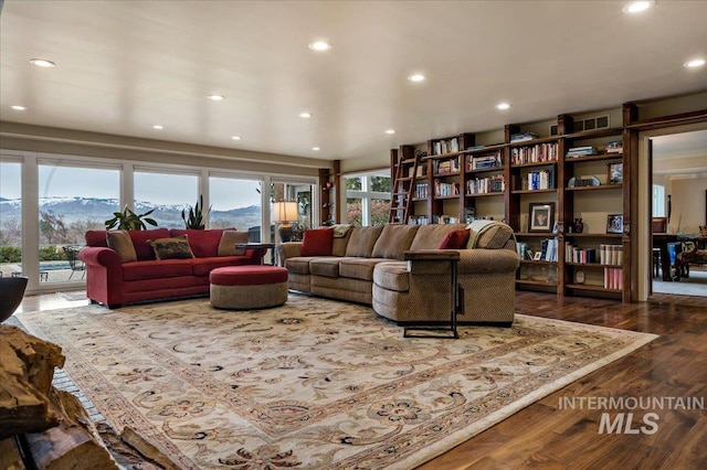 living area featuring recessed lighting, a mountain view, and dark wood-style flooring