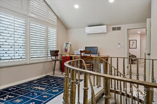 home office featuring visible vents, baseboards, lofted ceiling, recessed lighting, and a wall mounted AC