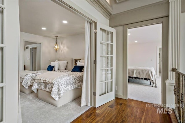 bedroom featuring dark wood finished floors, recessed lighting, and visible vents