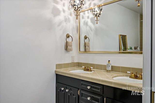 full bath with double vanity and a sink