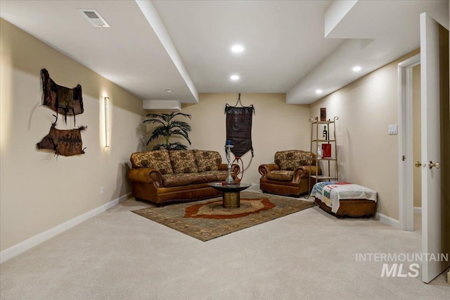 carpeted living room featuring visible vents, recessed lighting, and baseboards