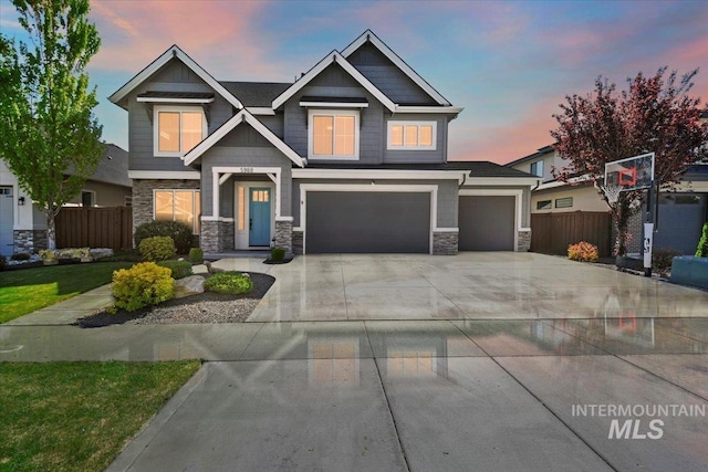 5988 N Lichfield Ave, Meridian, ID 83646 - craftsman house with fence, concrete driveway, a garage, and stone siding