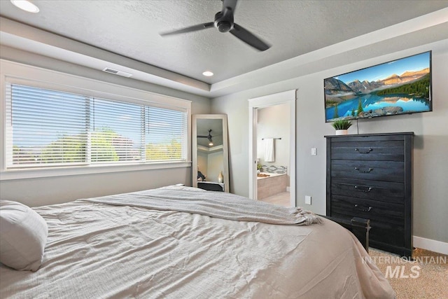 5988 N Lichfield Ave, Meridian, ID 83646 - bedroom with visible vents, baseboards, connected bathroom, a textured ceiling, and carpet