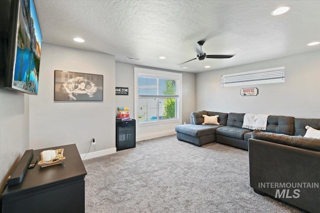 5988 N Lichfield Ave, Meridian, ID 83646 - carpeted living area with a textured ceiling, ceiling fan, recessed lighting, and baseboards
