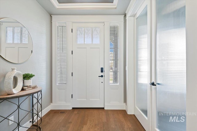 5988 N Lichfield Ave, Meridian, ID 83646 - entrance foyer with baseboards, wood finished floors, and visible vents