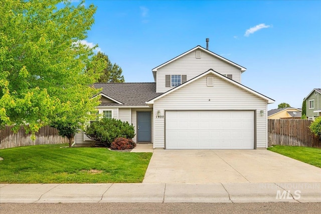 1400 W Florida Ave, Nampa, ID 83686 - traditional-style house featuring driveway, a garage, and a shingled roof