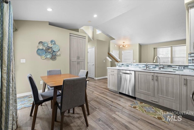 1400 W Florida Ave, Nampa, ID 83686 - dining space with light wood-style floors, baseboards, lofted ceiling, and recessed lighting