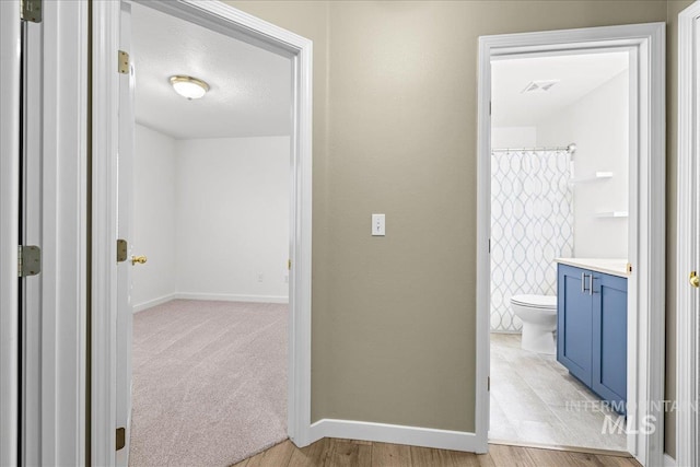 1400 W Florida Ave, Nampa, ID 83686 - hall with baseboards and light wood finished floors