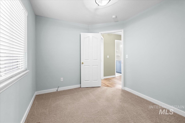 1400 W Florida Ave, Nampa, ID 83686 - carpeted empty room with baseboards