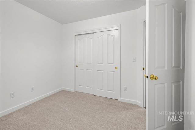 1400 W Florida Ave, Nampa, ID 83686 - unfurnished bedroom with carpet flooring, baseboards, and a closet
