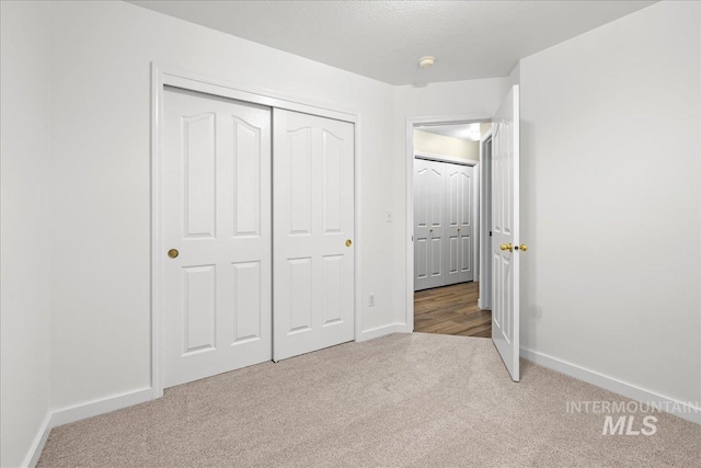 1400 W Florida Ave, Nampa, ID 83686 - unfurnished bedroom with carpet floors, baseboards, and a closet