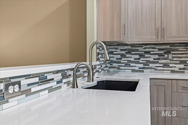 1400 W Florida Ave, Nampa, ID 83686 - kitchen view of a sink, backsplash, and light countertops