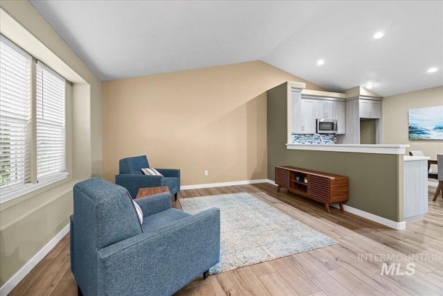 1400 W Florida Ave, Nampa, ID 83686 - sitting room featuring baseboards, lofted ceiling, light wood finished floors, and recessed lighting