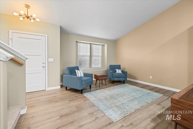 1400 W Florida Ave, Nampa, ID 83686 - living area with light wood-style floors, a chandelier, and baseboards