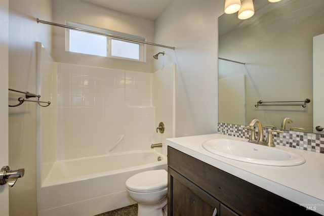 full bathroom featuring shower / bath combination, tasteful backsplash, toilet, and vanity