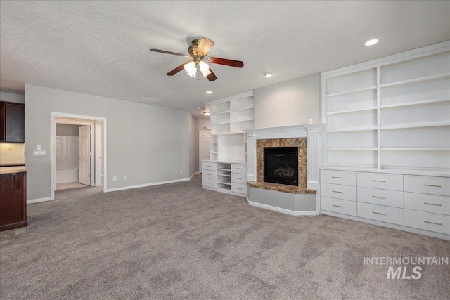 633 S Archstone Way, Boise, ID 83709 - unfurnished living room featuring ceiling fan, a high end fireplace, a textured ceiling, carpet, and recessed lighting