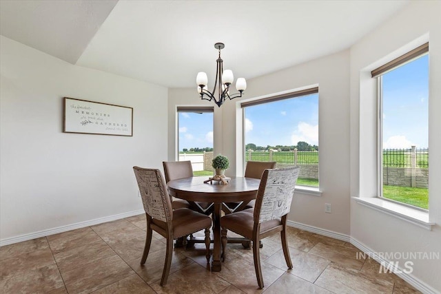 dining room with a notable chandelier