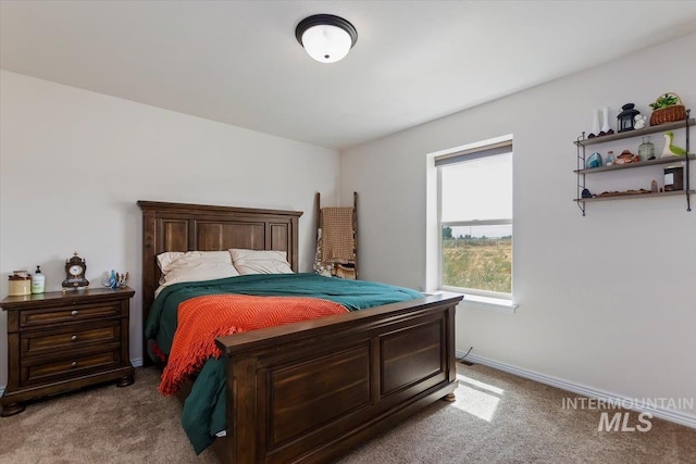 bedroom featuring light carpet