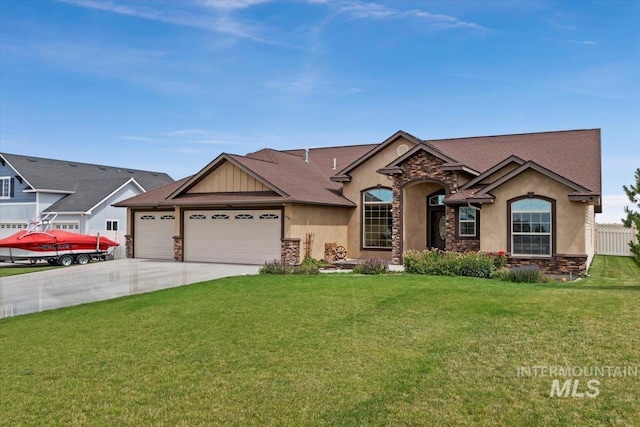 view of front of home featuring a garage and a front lawn