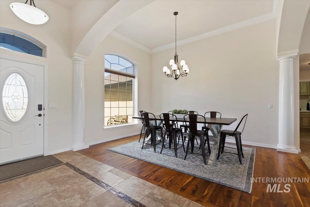 dining room featuring a notable chandelier and ornamental molding