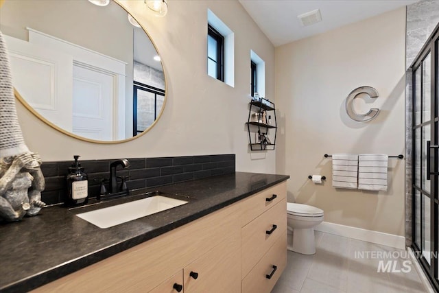 965 S Ranch House Way, Eagle, ID 83616 - bathroom with a shower stall, vanity, toilet, tile patterned floors, and baseboards