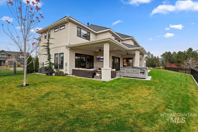 965 S Ranch House Way, Eagle, ID 83616 - back of house featuring an outdoor hangout area, a ceiling fan, stucco siding, and a patio
