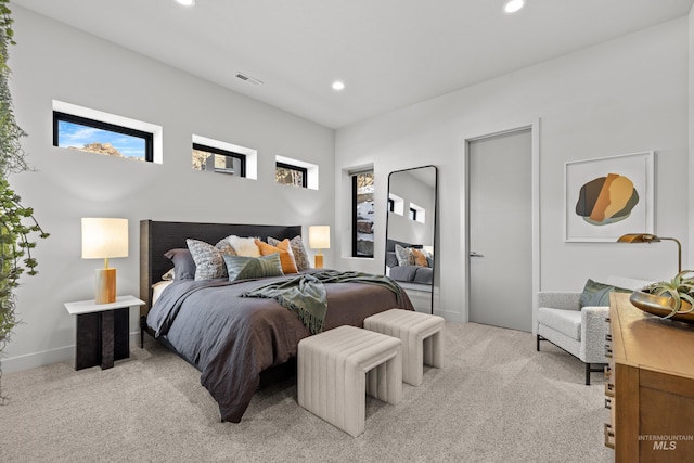 bedroom featuring baseboards, recessed lighting, visible vents, and light colored carpet