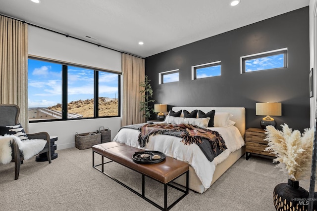 bedroom featuring baseboards, recessed lighting, visible vents, and light colored carpet