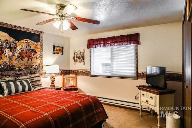 bedroom with carpet flooring, a ceiling fan, a baseboard radiator, and a textured ceiling