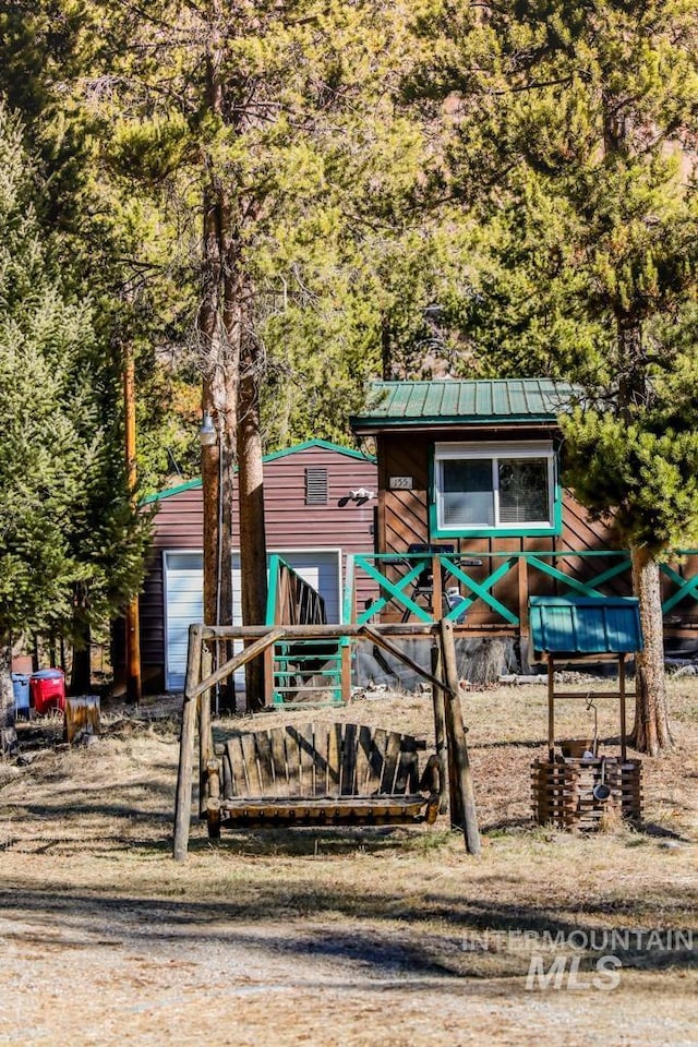 view of playground with an outdoor structure