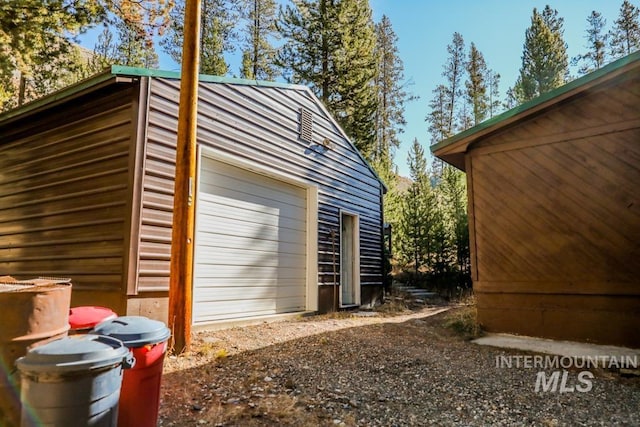 exterior space with an outdoor structure and driveway