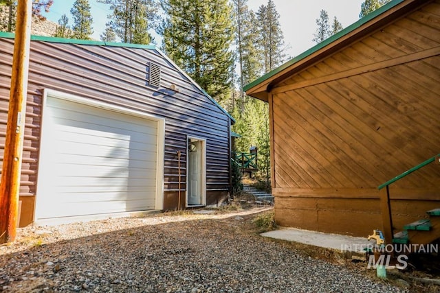 detached garage featuring driveway