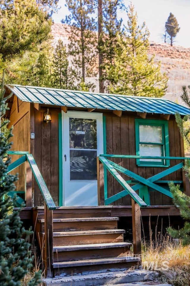 view of outbuilding featuring an outbuilding and entry steps