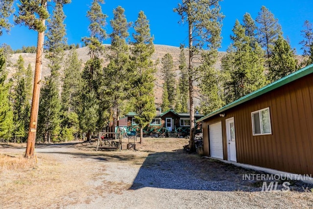 view of yard with driveway and an attached garage