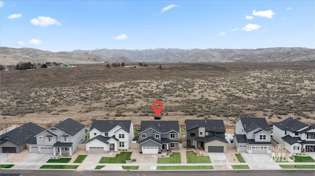 drone / aerial view with a residential view and a mountain view